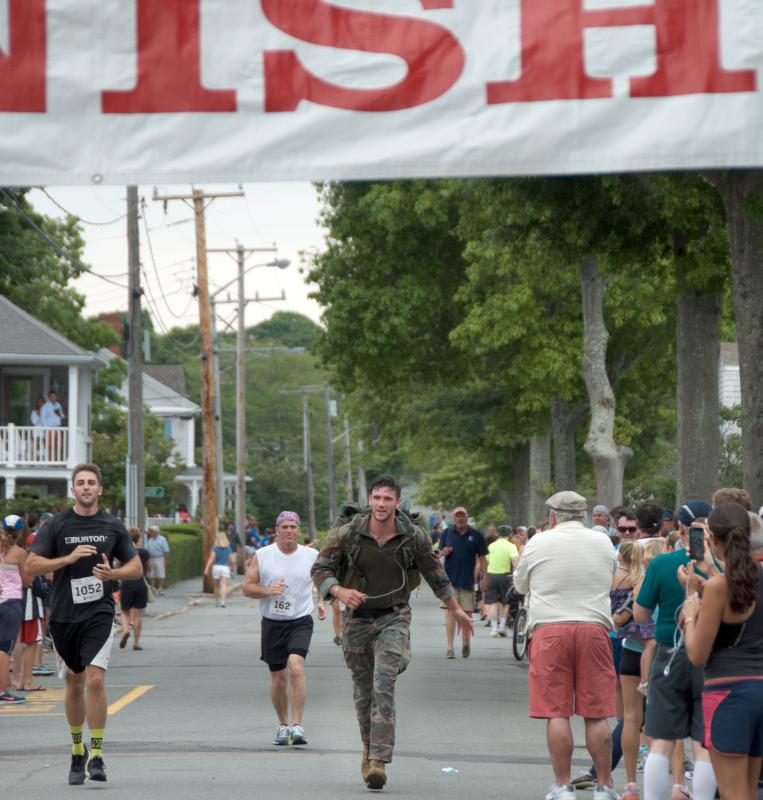 Sgt. Billy Simpson finishes the race with 70 pounds in his pack to honor seven fallen Special Ops Marines. BY GEORGIA SPARLING